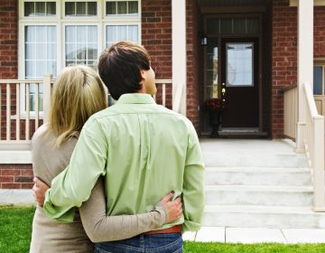 Young happy couple shopping for new home